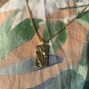 Stamped floral pendant